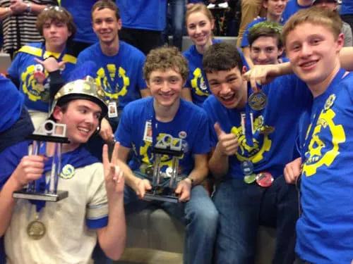 Spartronics students celebrating with their trophies