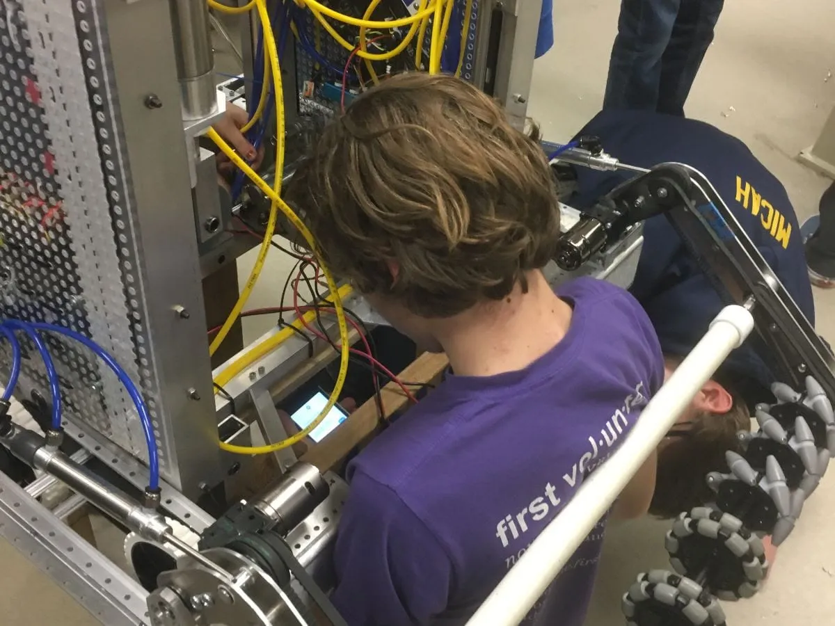 Spartronics student working on the robot