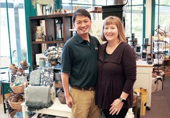 The owners of Ace Hardware pose in their store