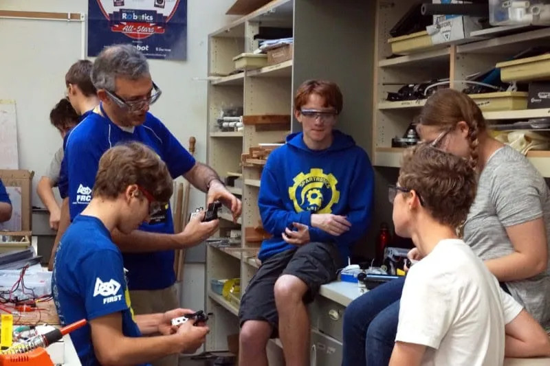 A Spartronics mentor teaches students
