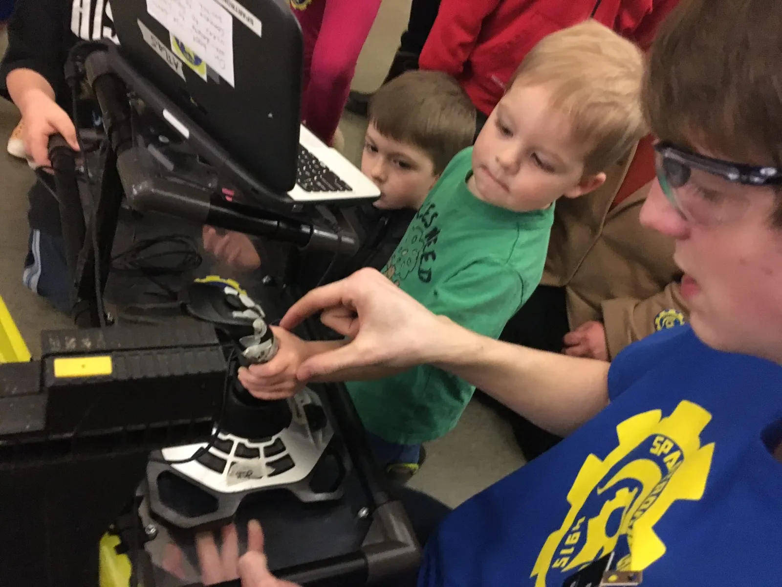 Robby Davis helps 3-year old Desmond drive ATLaS our first robot!