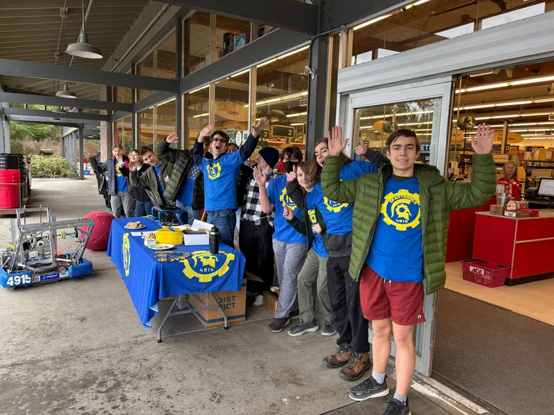 Spartronics team members at an event